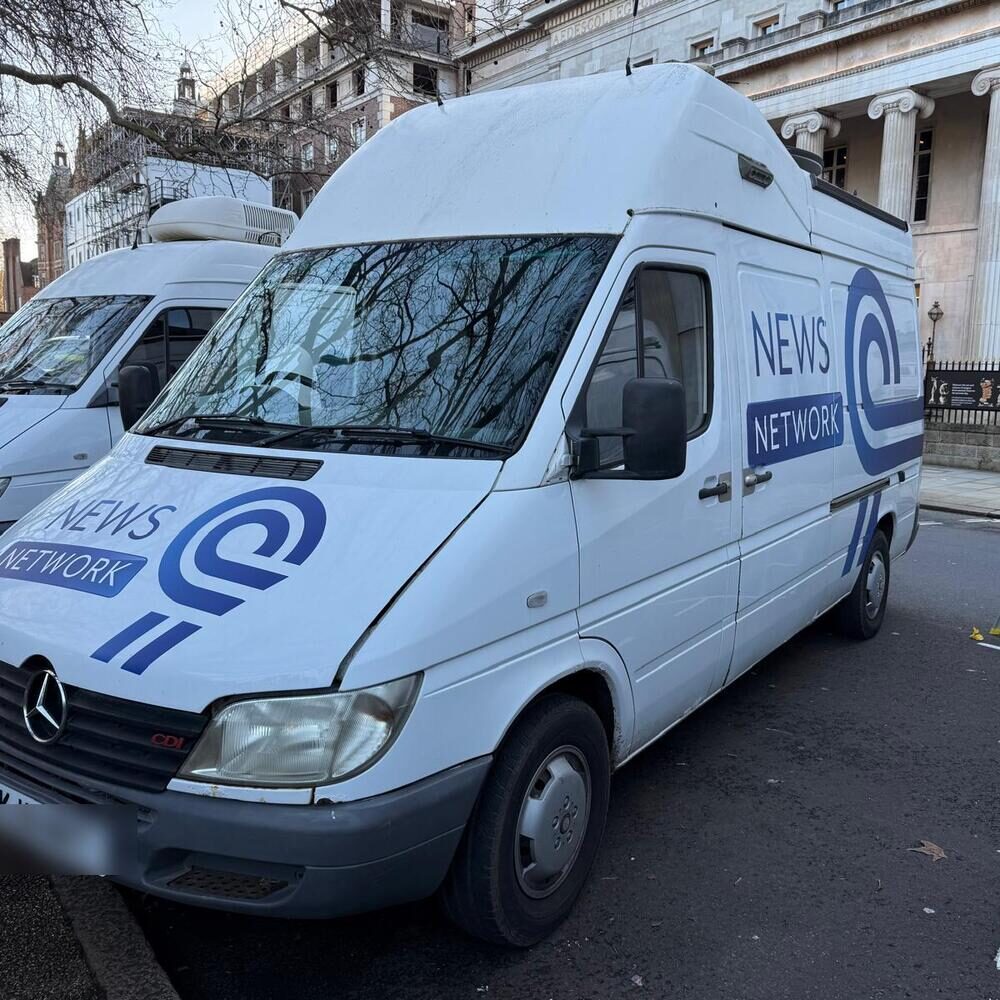 The same van in a full fictional News Network wrap