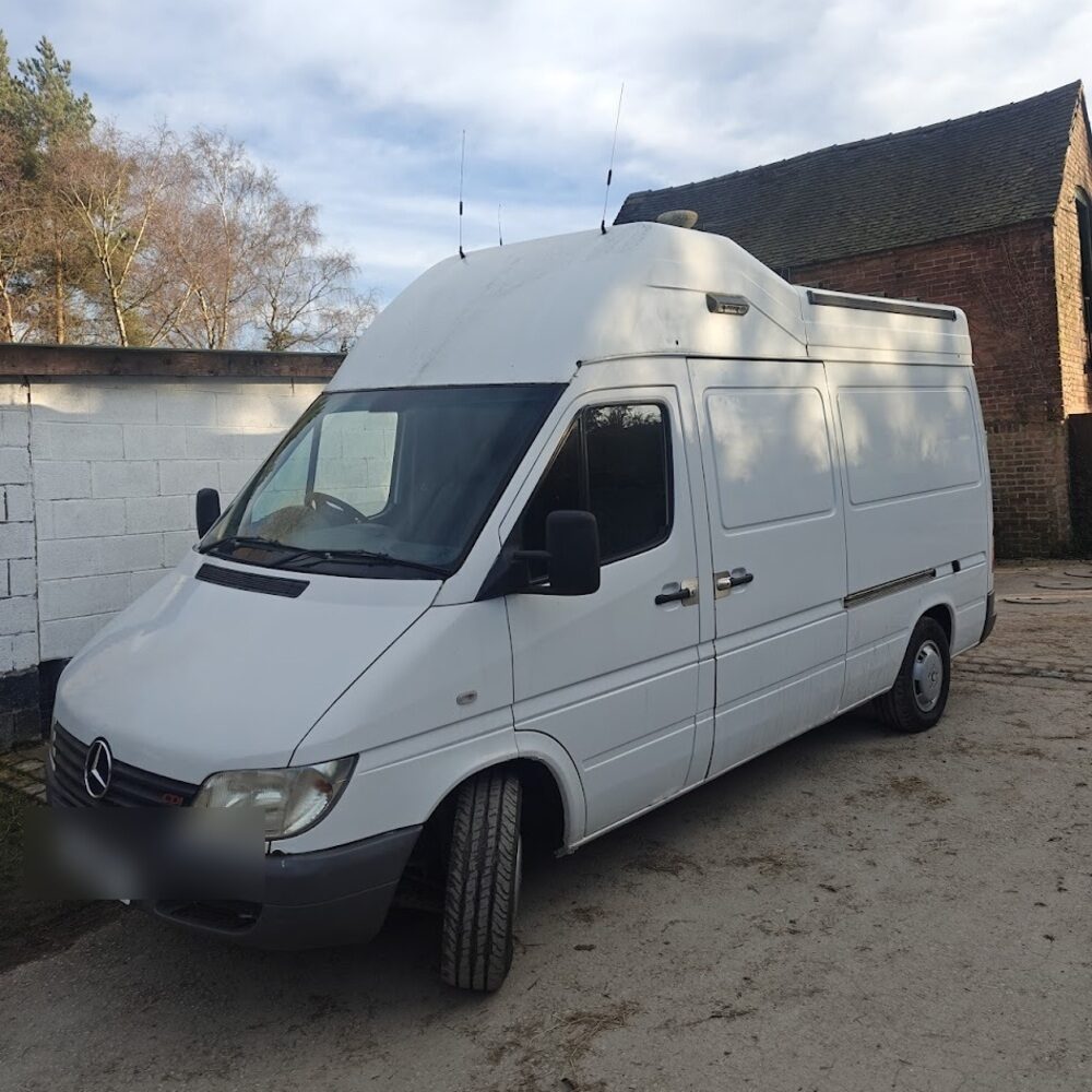The van unbranded — plain white bodywork